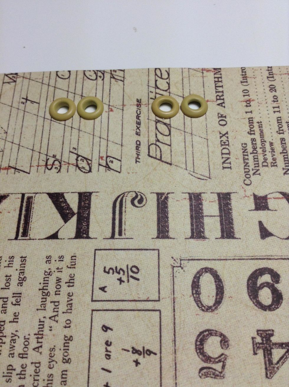 Cut a piece of paper, insert four eyelets  and use adhesive to adhere it to the interior cardboard .