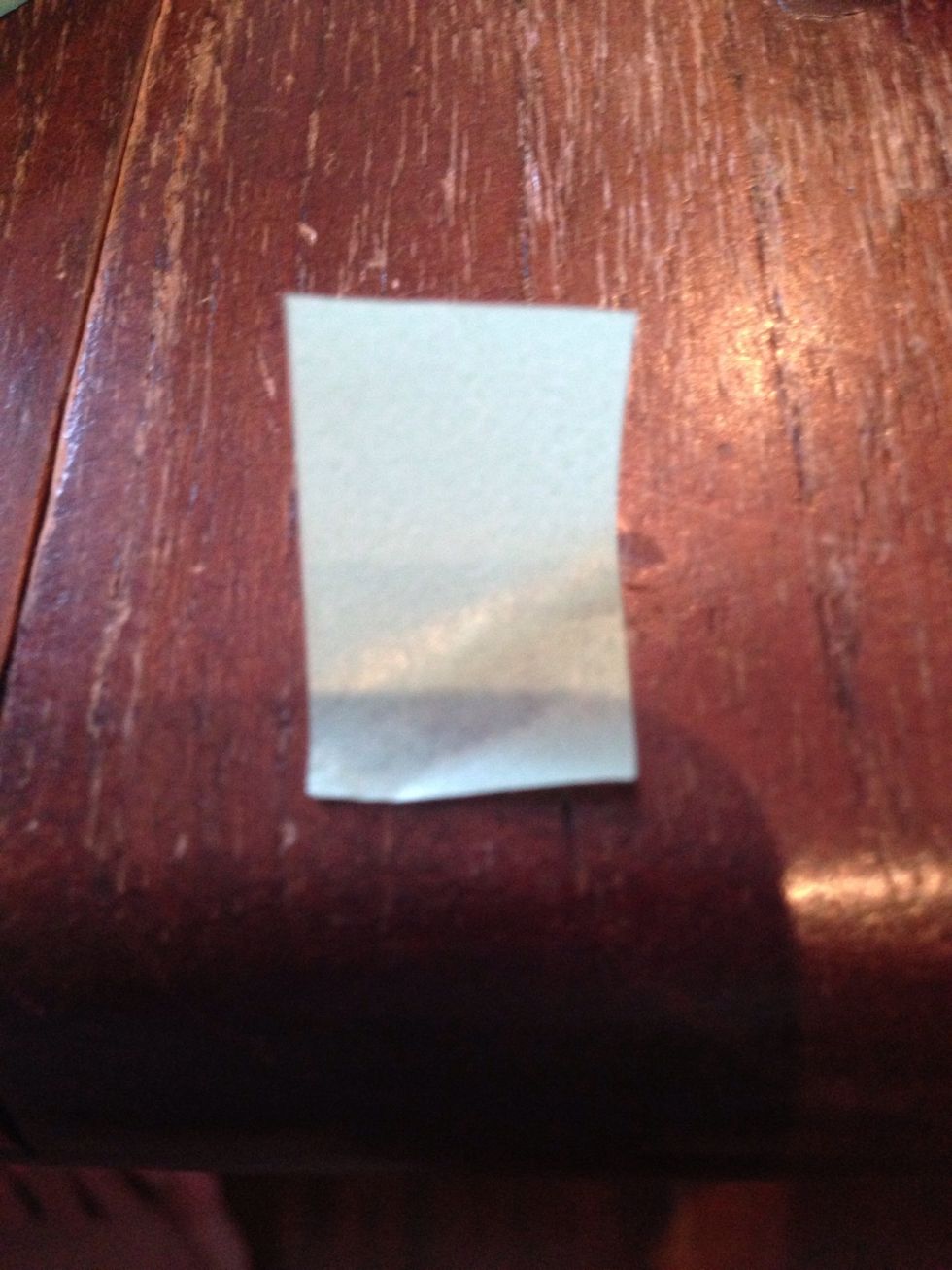 Cut a piece of paper tape ( plastic tape is fine).