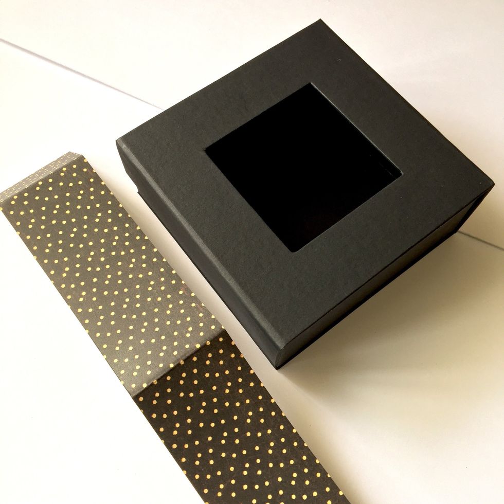 Cut a piece of paper to cover box sides.