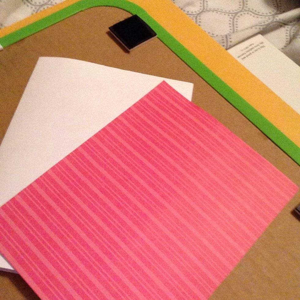 Cut a piece of patterned paper the same size as the front of the white paper.