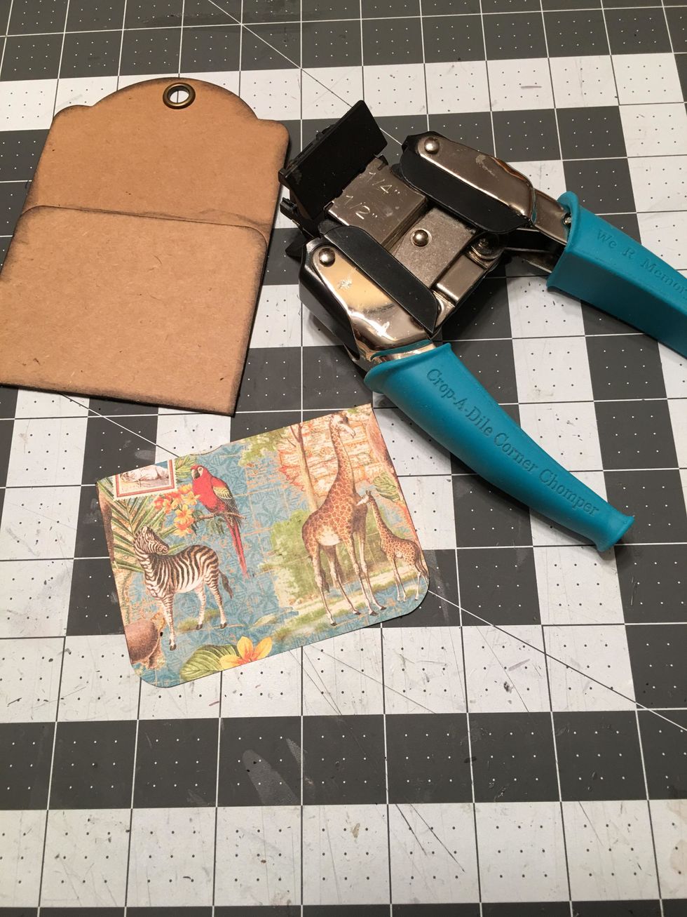 Cut a piece of patterned paper to fit the pocket and use a 1/2 inch corner rounder for the two bottom corners.
