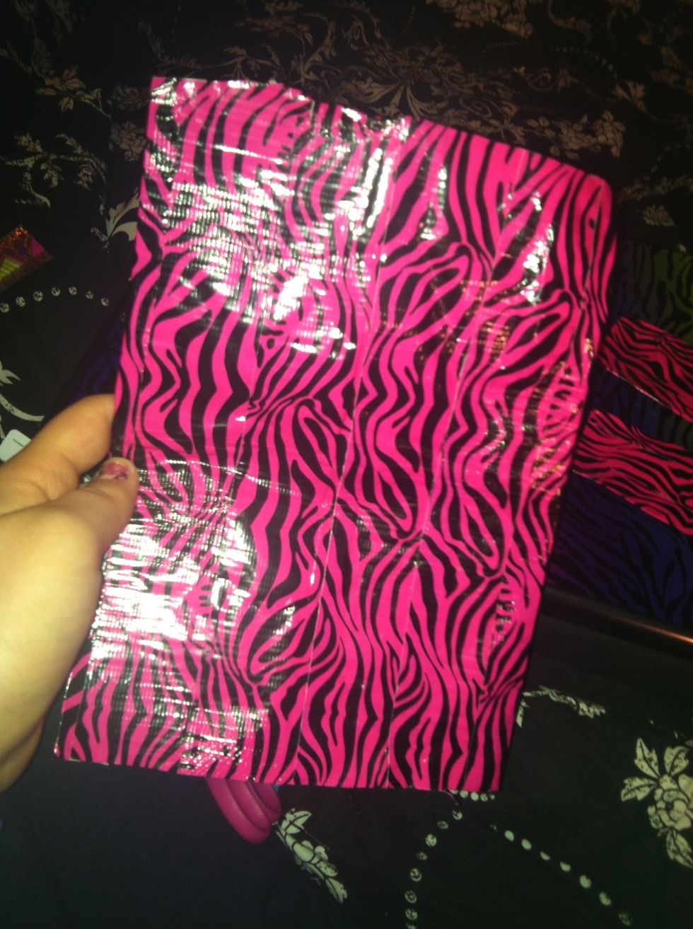 Cut a piece of tape a little bit longer than the length of your wallet. Tear the strip in half and create smooth seams on both sides like you did with your long strip to make your credit card pockets