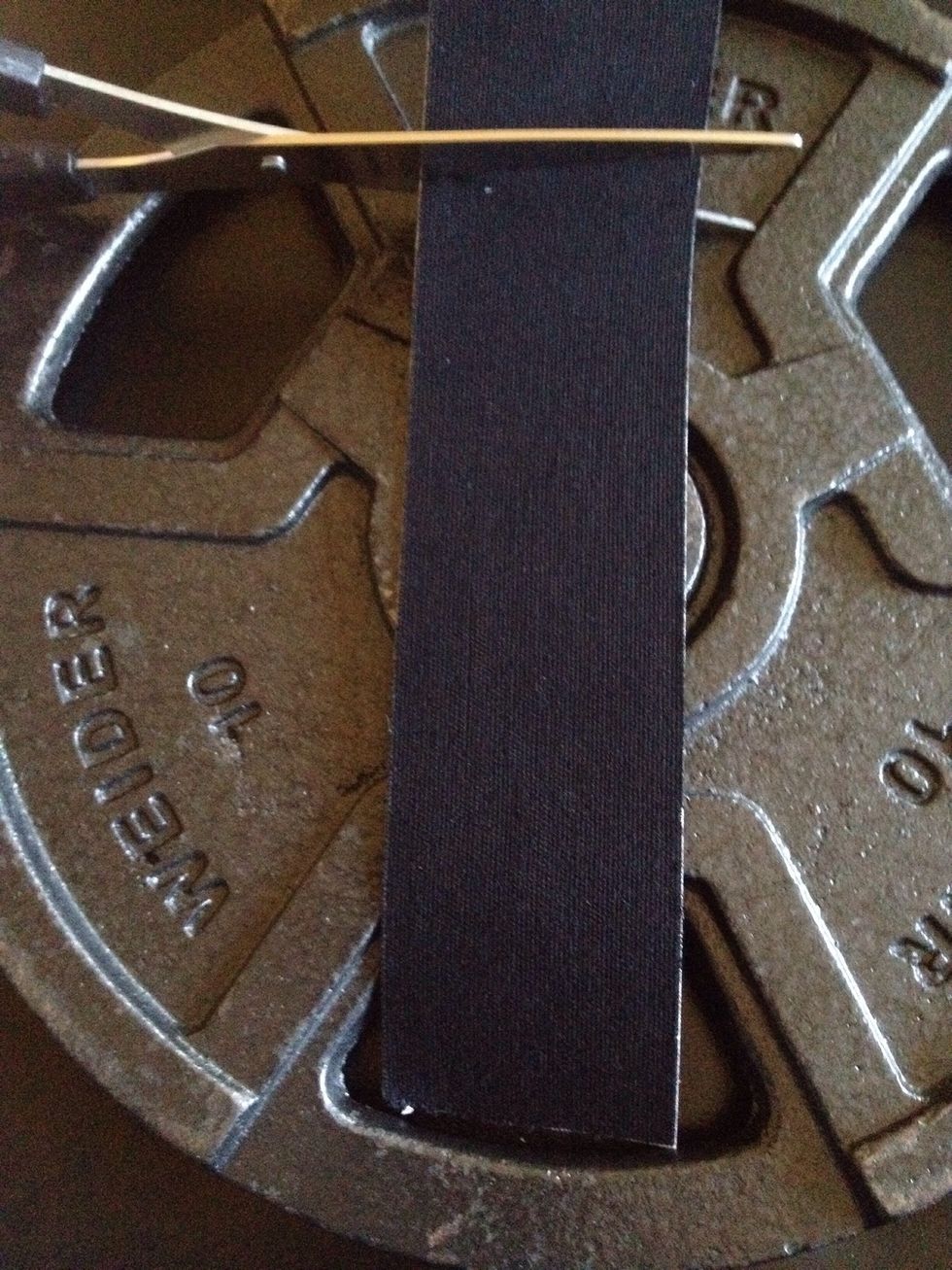 Cut a piece of tape about an inch shorter than your wrist's circumference (Approximately 6 in.).  Take into account that the tape does stretch and does not adhere properly if overlapped.