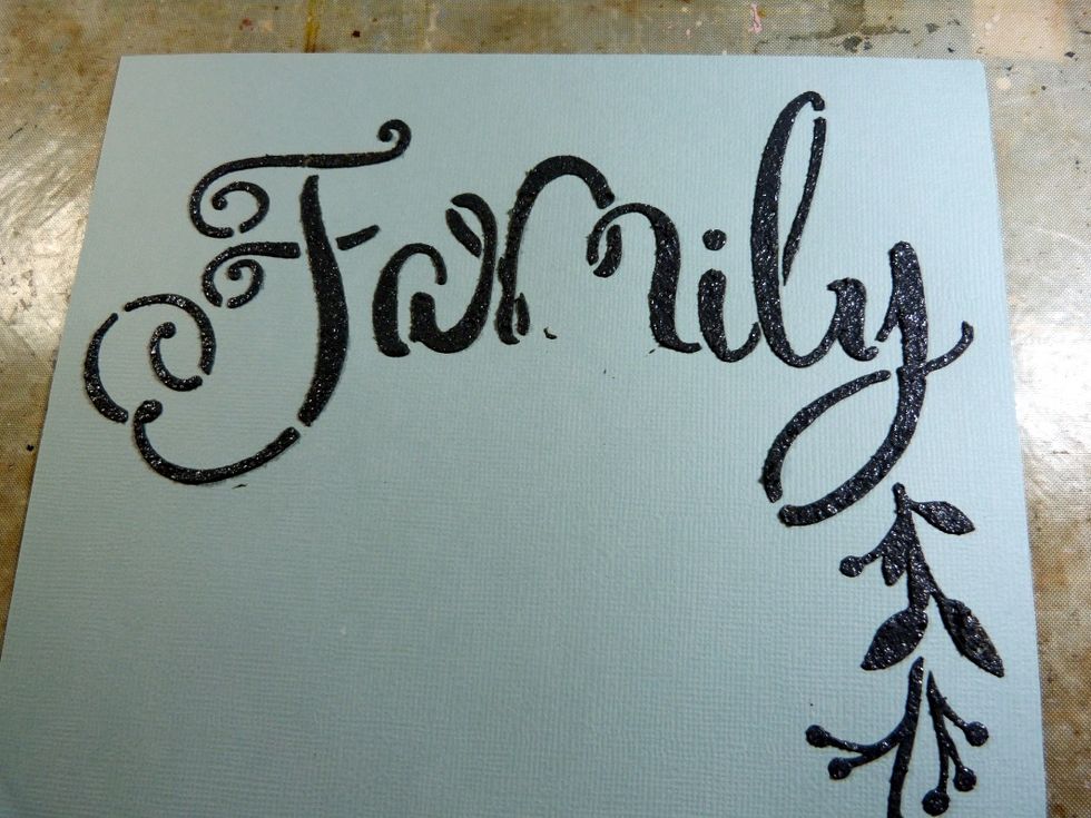 Cut a piece of the pale blue cardstock, from the Cardstock Add on, to fit the inside of your box. Using the 'family' from the Stencil in the kit, texture paste onto the cardstock. Dry.