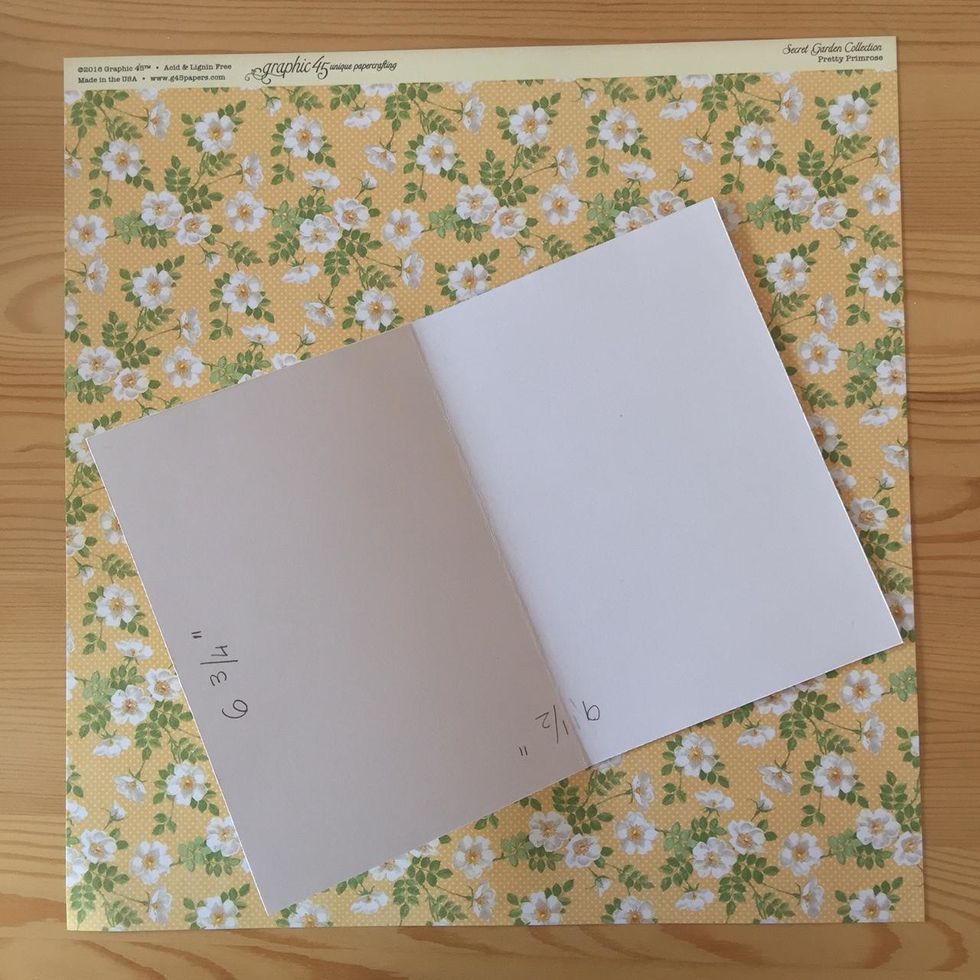 Cut a piece of white cardstock. Fold in half.