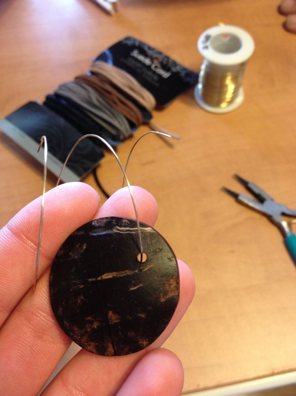 Cut a piece of wire and slide it into the hole.