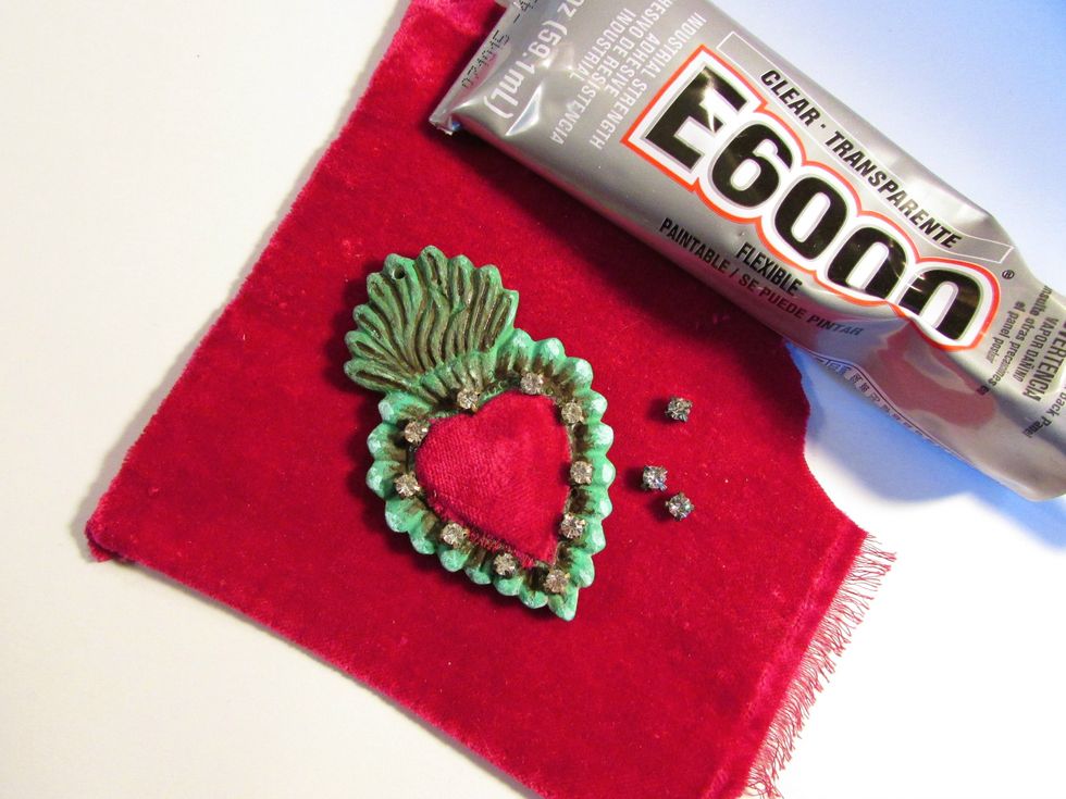 Cut a piece velvet to line the inside part of the heart and glue some rhinestones to hide the seams