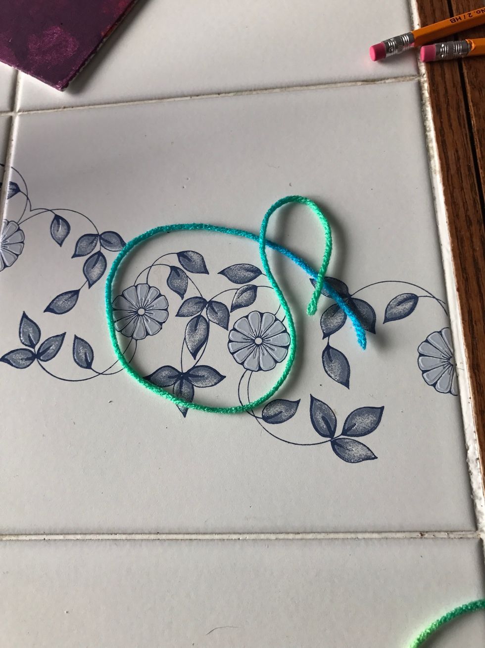 Cut a price of yarn approx=3"