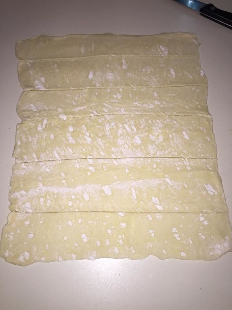 Cut a puff pastry sheet into 6 strips.