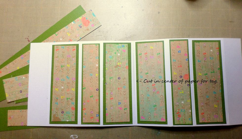 Cut a slit in the center of the cardstock for the tag to fit through.  Decorate your strips as you wish.  I cut green cardstock and patterned paper from Susan K. Weckesser.