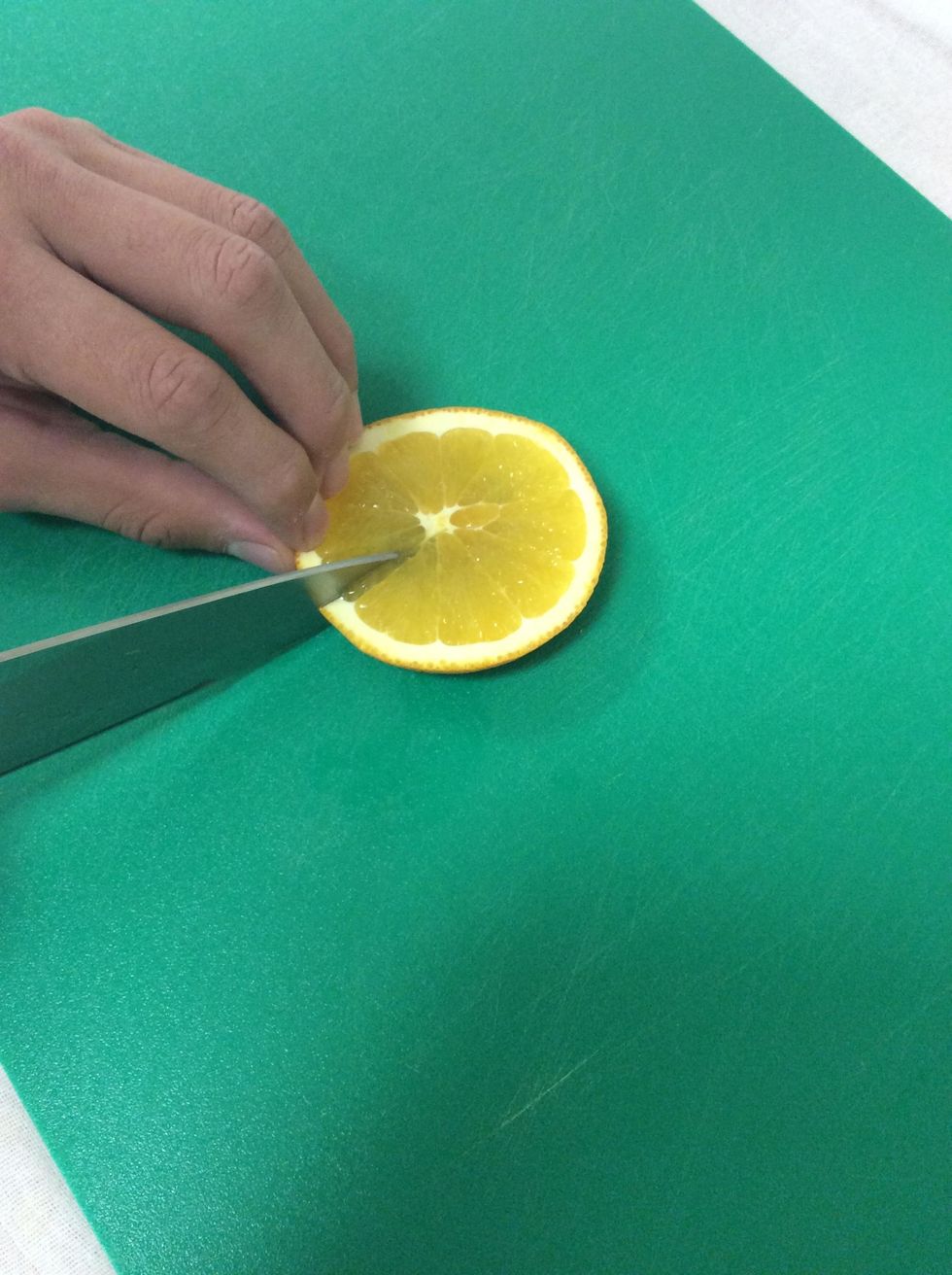 Cut a slit in the center of the solid half.
