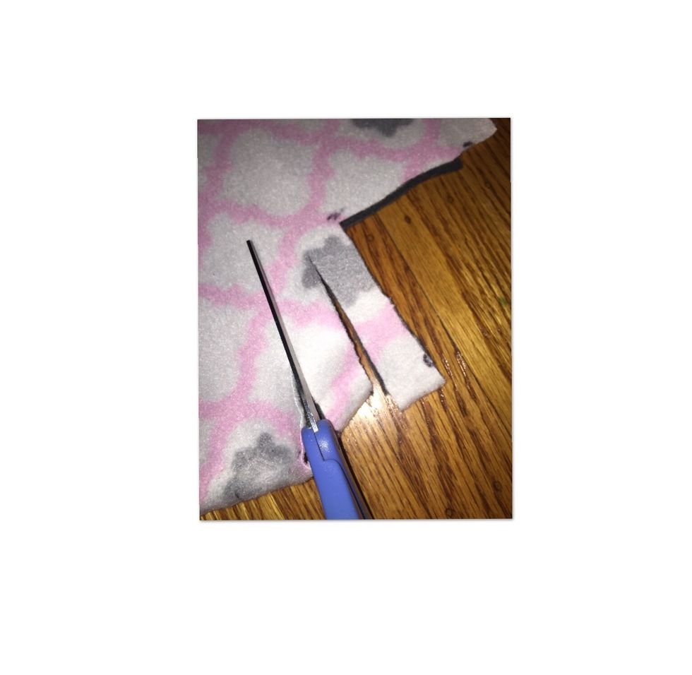 Cut a slit into the cloth about 4 inches deep for every mark you have made around the perimeter of the cloths.