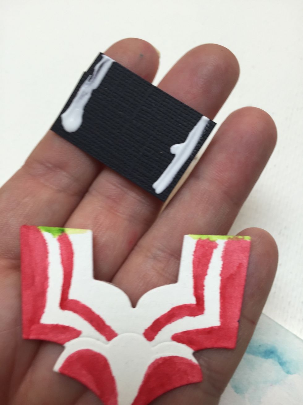 Cut a small piece if black cardstock and glue it in the back. That will help you create the mysterious drama of the circus magic inside!