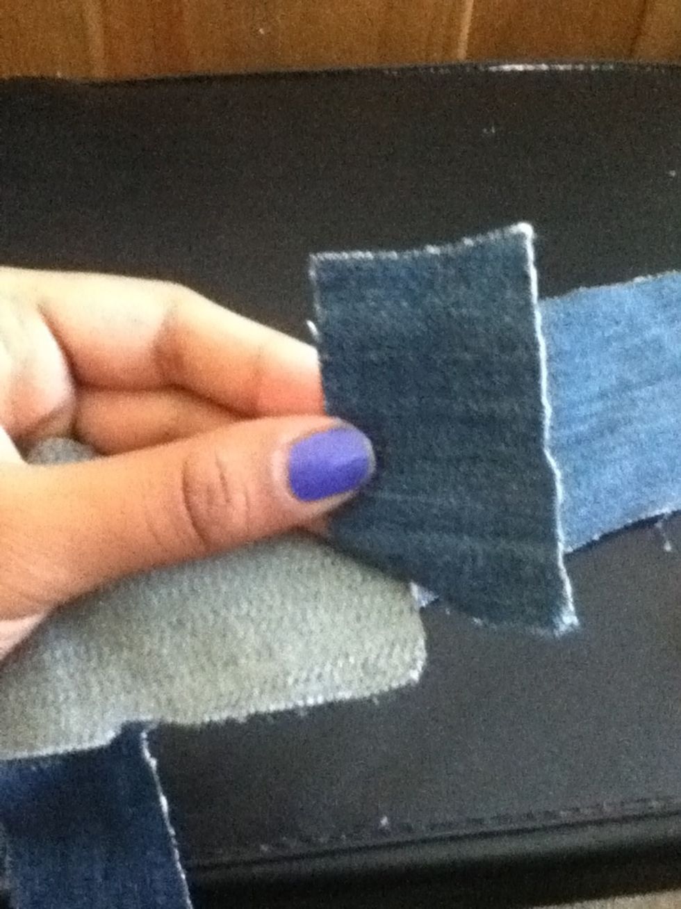 Cut a small rectangle from the left over jean that you cut off
