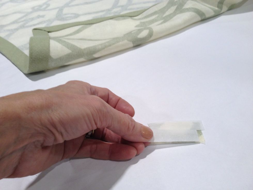 Cut a small rectangle of fabric about  1" x 2". Apply two small pieces of Steam-a-Seam