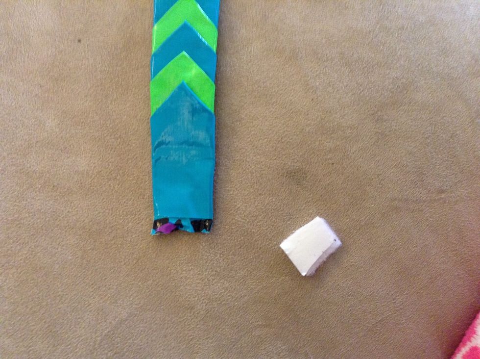 Cut a small square of velcrow