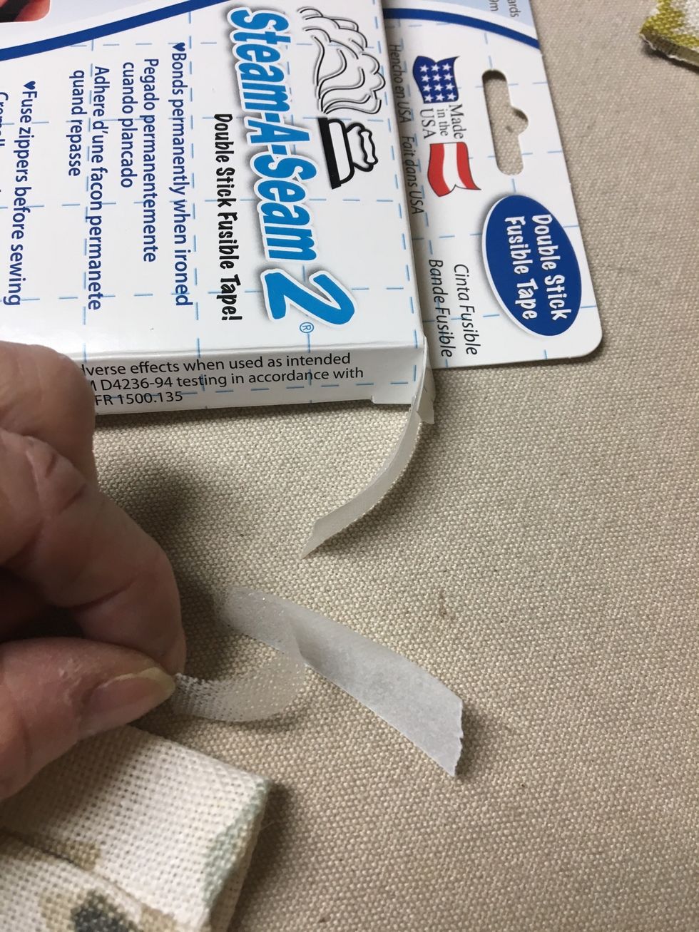 Cut a small strip of SteamASeam2 and peel the paper off.