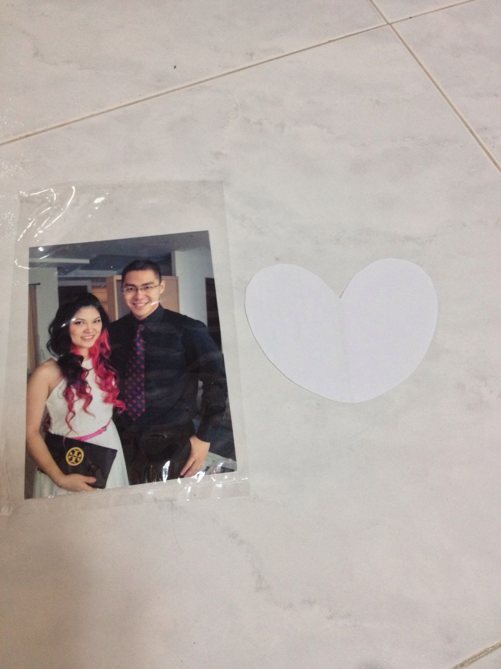 Cut a smaller heart shape paper as a guideline to cut ur photo to the shape, my photo is 5x7 inch, i think is better to get landscape photo (u ll see why in next step)