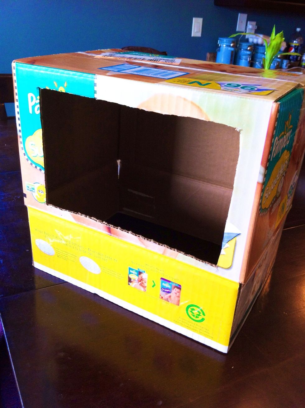 Cut a square hole with box cutter or serrated knife in the front.