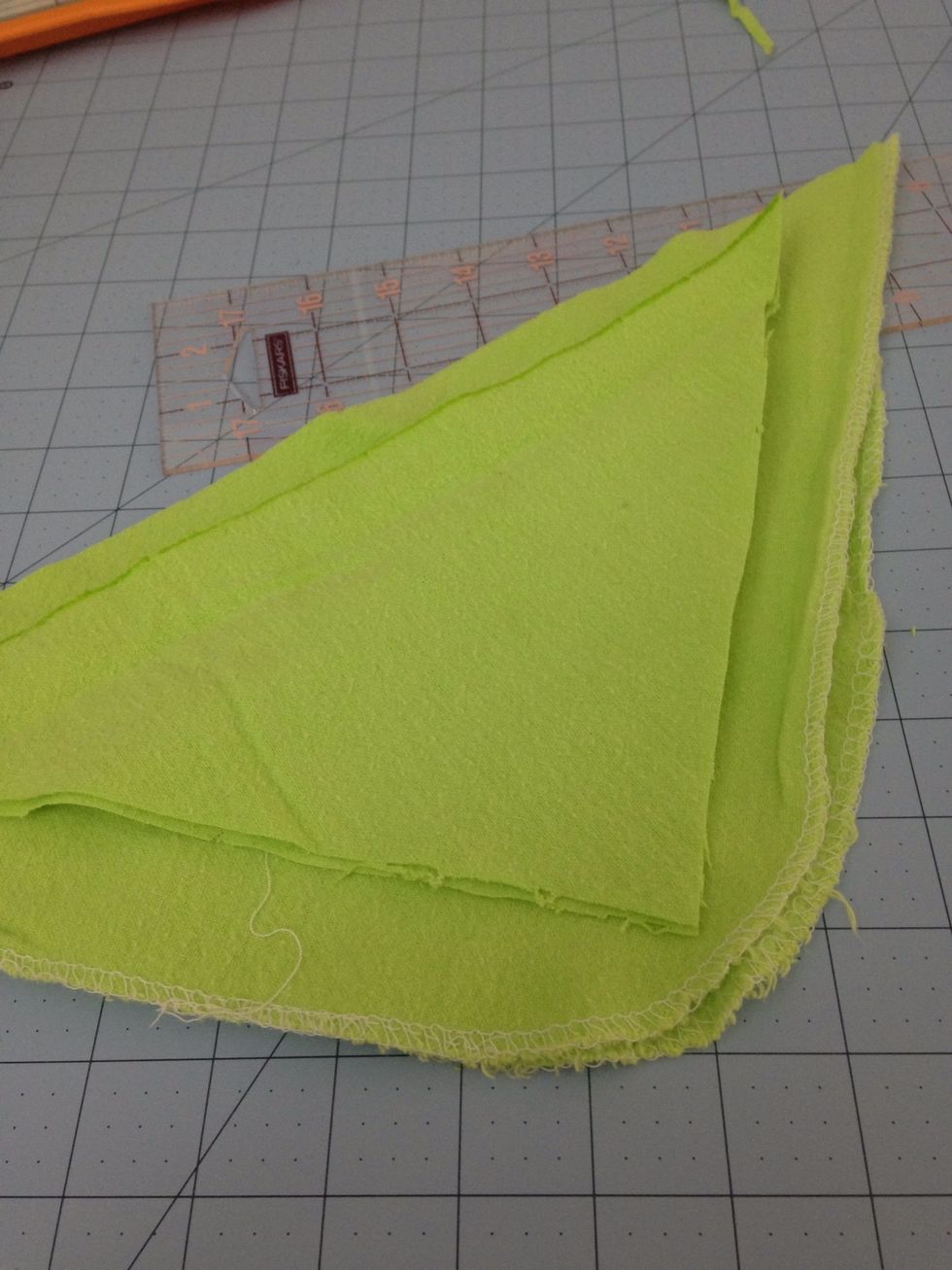 Cut a square the is about 2" smaller than the corner you cut when folded in half. This will be our beanbag and has to fit in the pocket.
