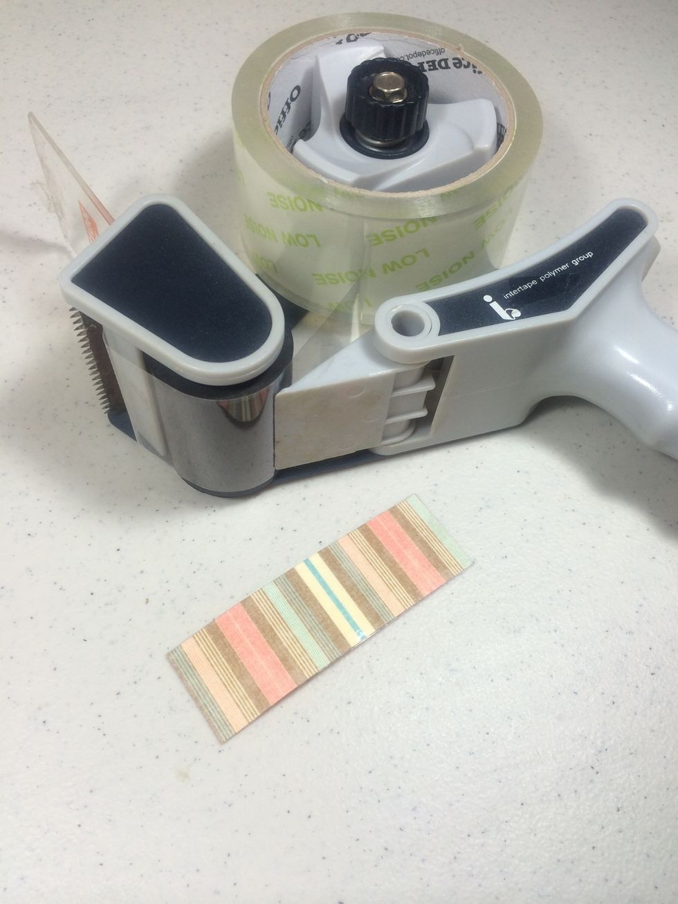 Cut a strip of accent paper 1 1/8" x 3 1/2" then laminate it with a piece of clear packing tape on both sides, trimming any excess.