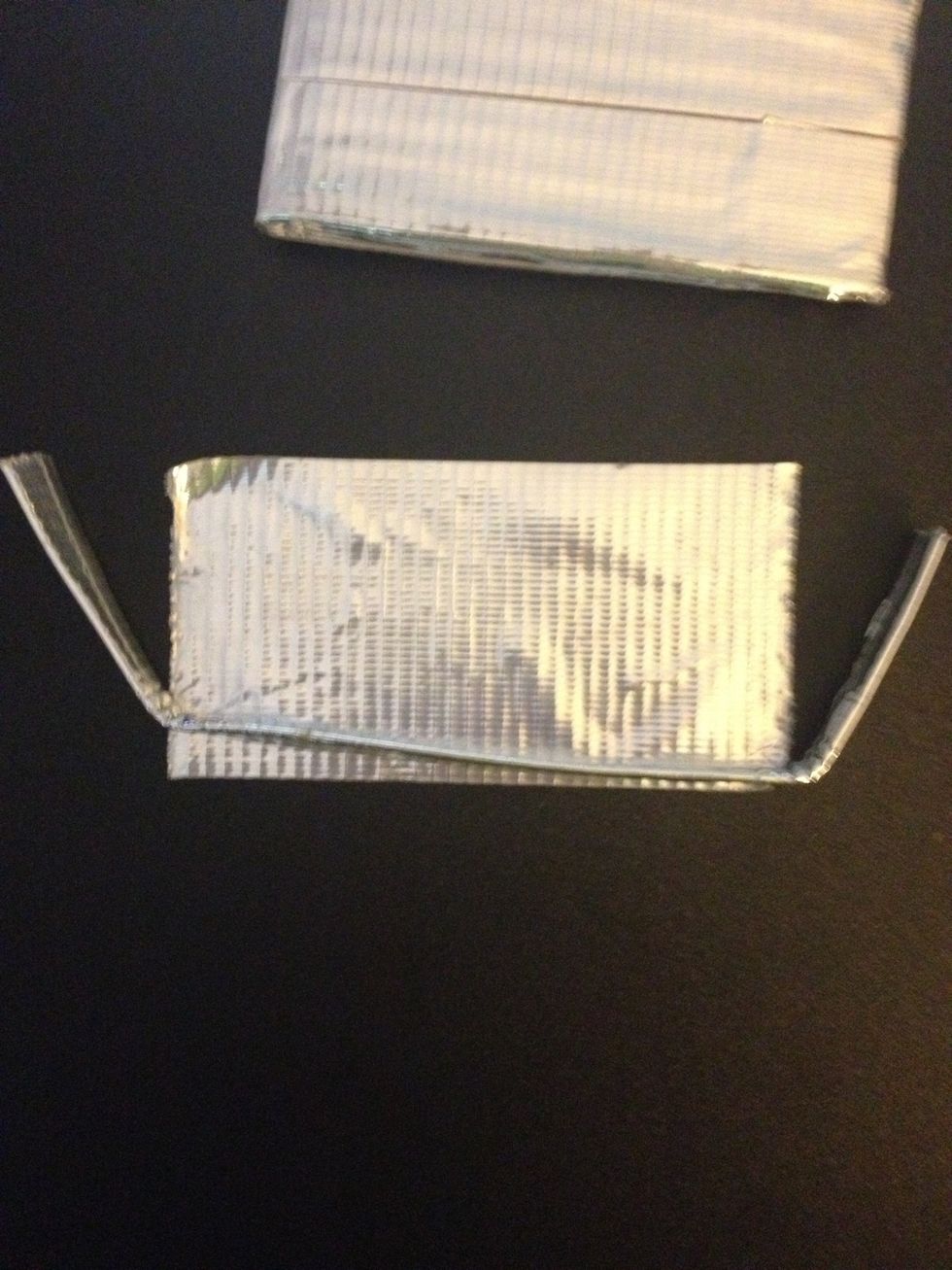 Cut a strip of duct tape the length of the not folded over piece of your hook.