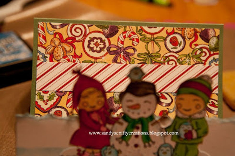 Cut a strip of scrap paper (optional) and adhere it to the card as shown