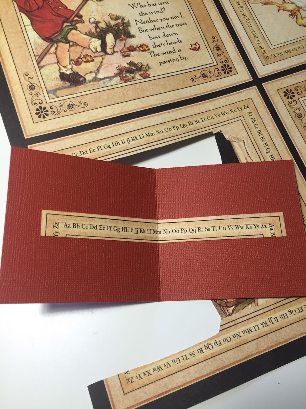 Cut a stripe of decorative paper and adhere it to the cardstock