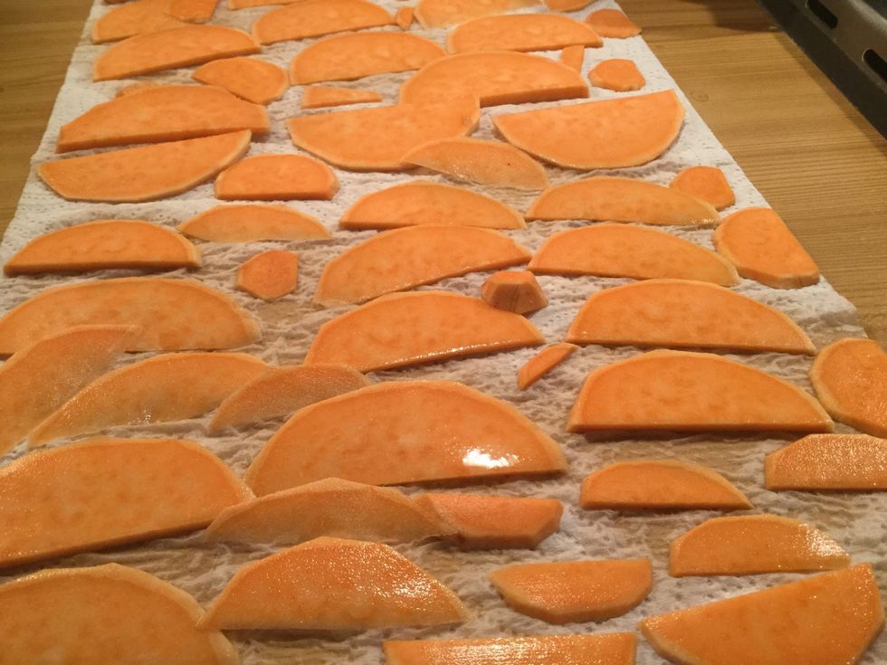 Cut a sweet potato in very small slices. Put the slices on a kitchen paper and sprinkle them with water.