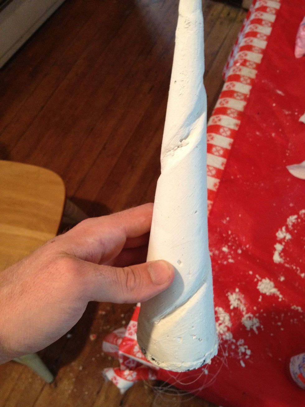 Cut a swivel shape into the dried plaster