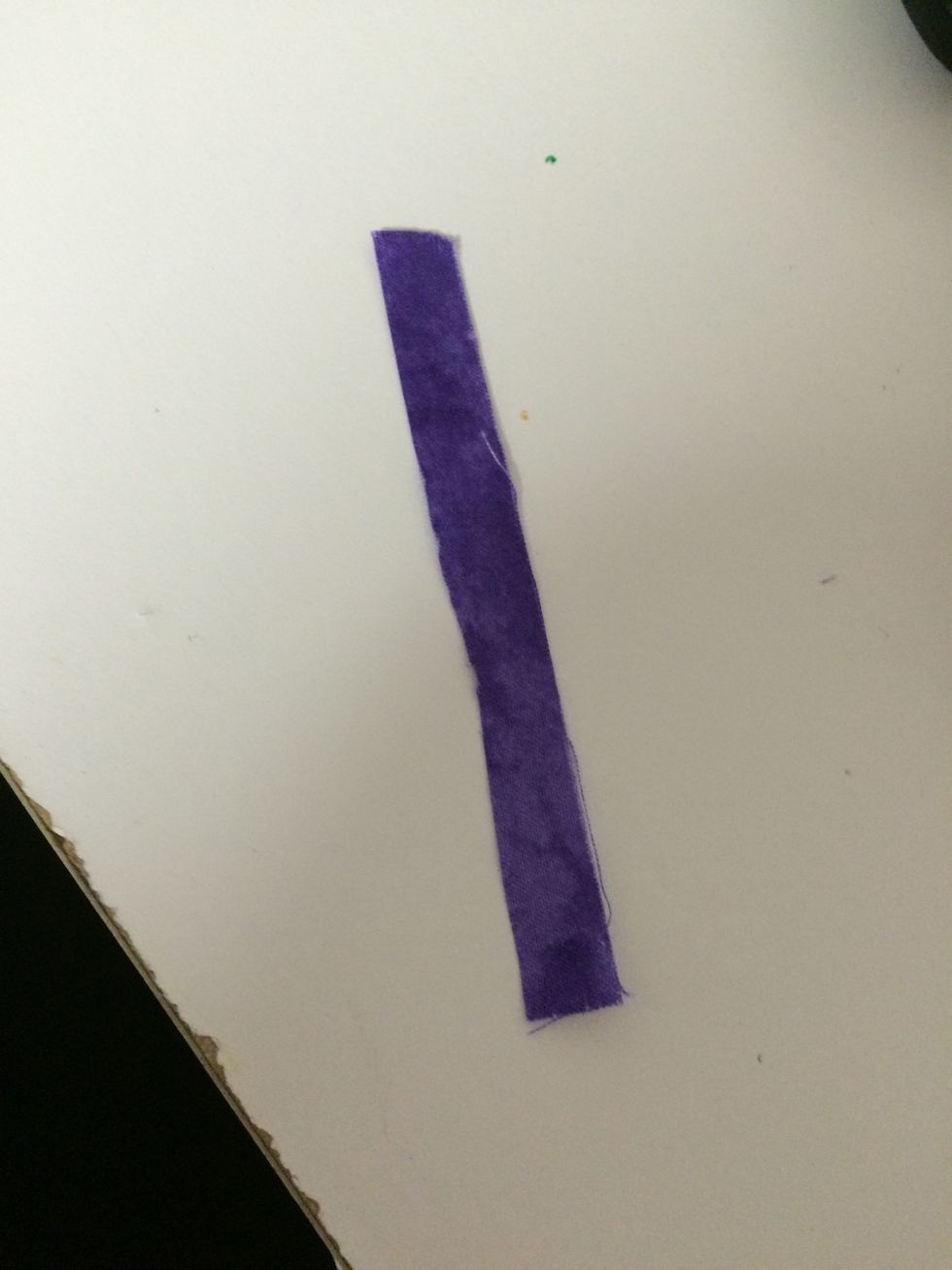 Cut a thin strip to wrap around the middle of the bow