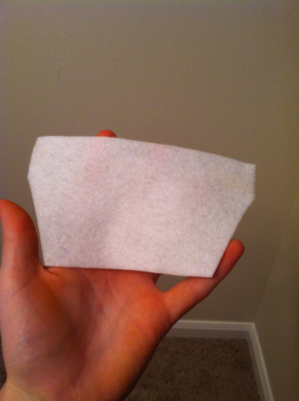 Cut a trapezoid-like shape from the white felt. This will end up being the teeth.