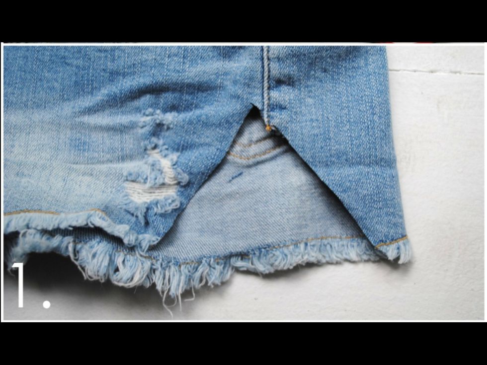 Cut a triangle out of your shorts that is roughly the shape of the lace. Make sure you cut the triangle exactly on the side seam.