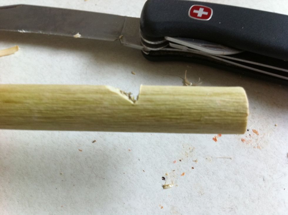 Cut a V shaped form in your whistle. 3cm from the front.