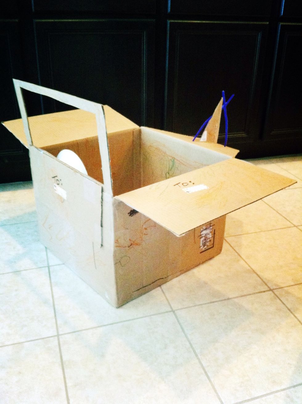 Cut a window in one flap.