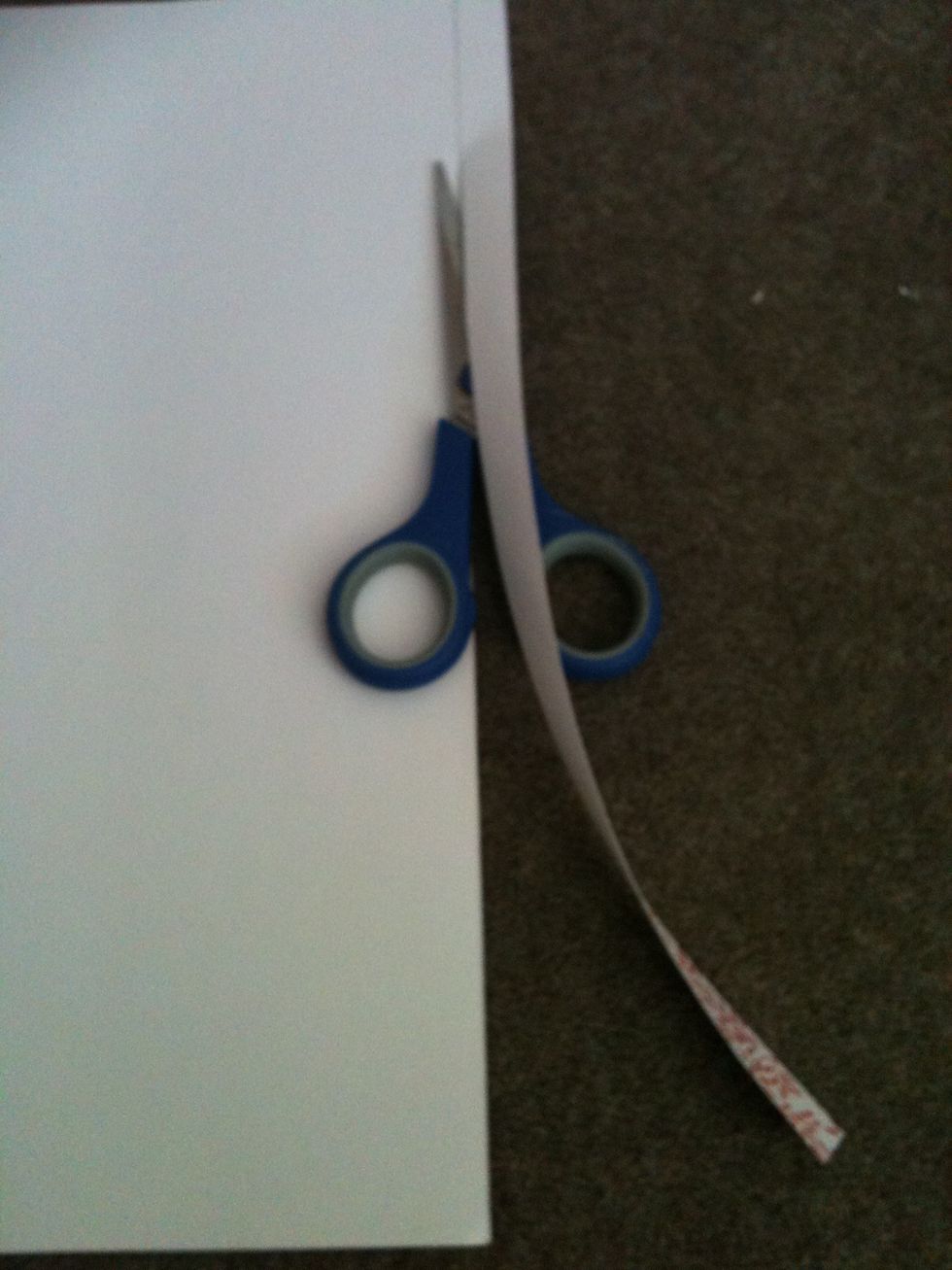 Cut about 1 and a half cm or 1inch strip off of your A3 piece of paper to make the handle