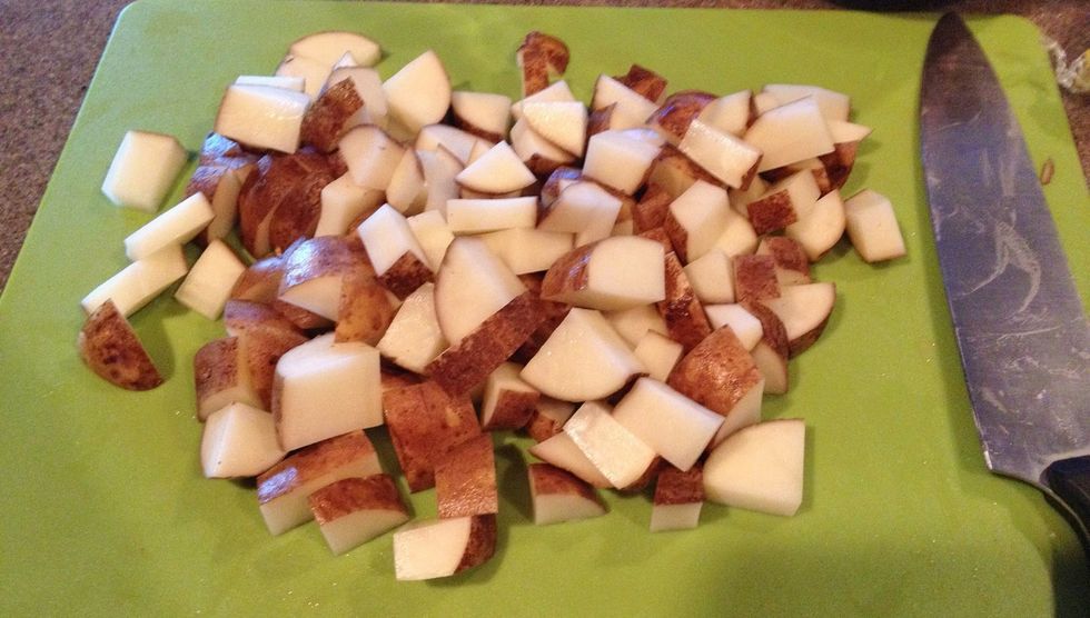 Cut about 6 potatoes - whatever you have on hand. I had russets this time, but red potatoes are delicious also. Yukons taste great, but are more starchy - add 1/4 c liquid for these.