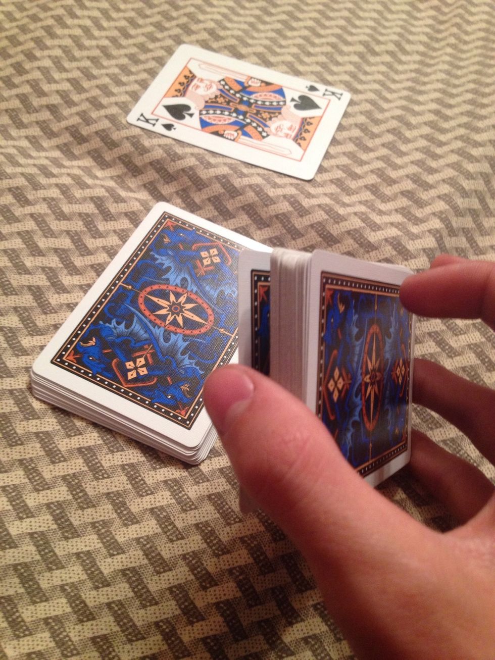 Cut about half of the deck off while keeping your pinky break.
