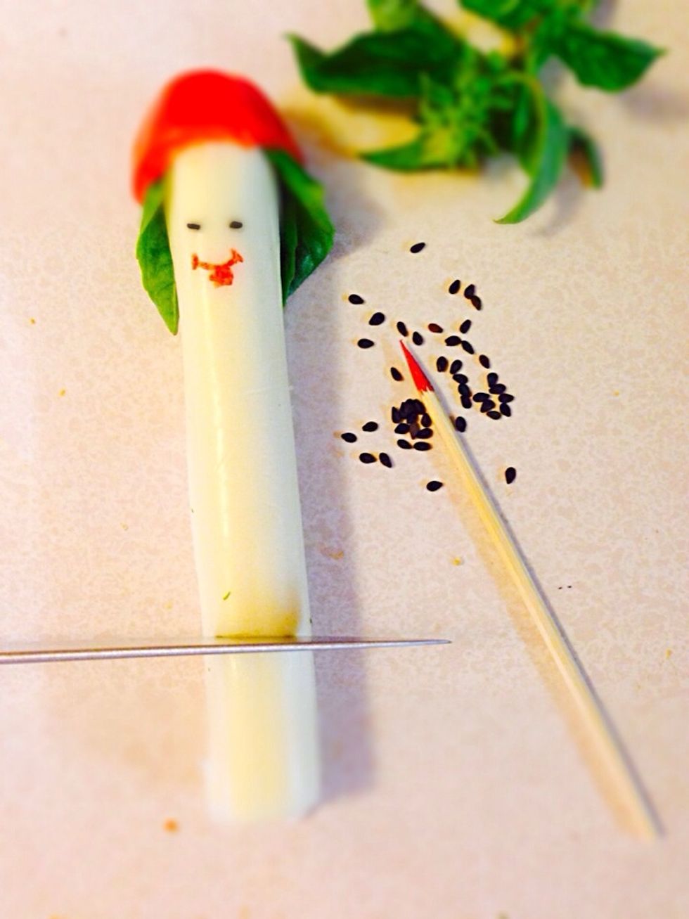 Cut about one inch from cheese stick. If it's too long it will not remain standing in his boat too long