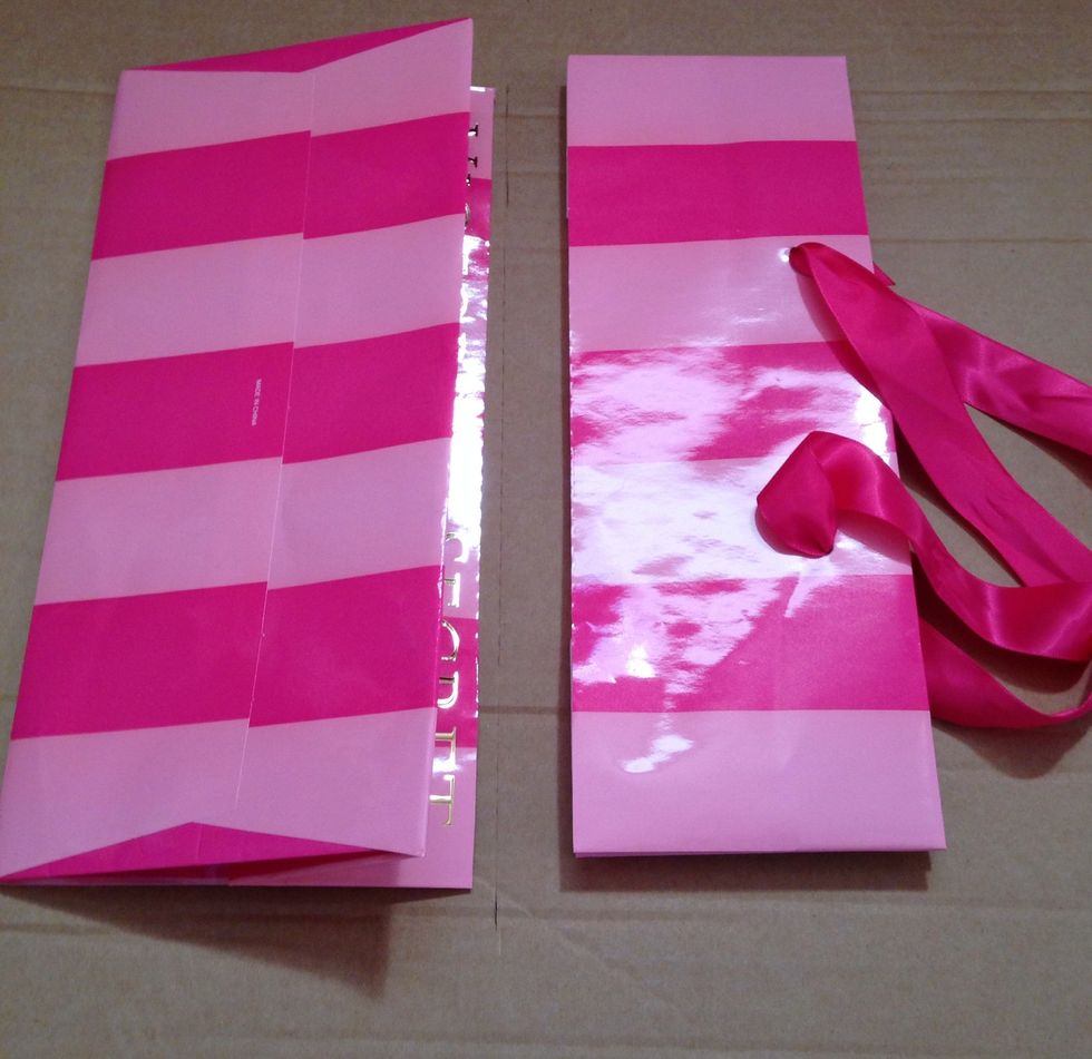 Cut across where the flat bottom meets the upper part of the bag.