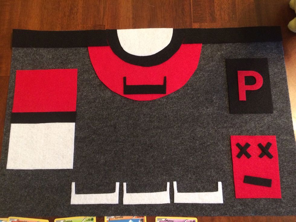 Cut adhesive felt into shapes and create two identical game mats with the following elements; 1) three "bench" spots 2) one pile area 3) one "knock-out" area 4) one "field" spot 5) one "prize" area