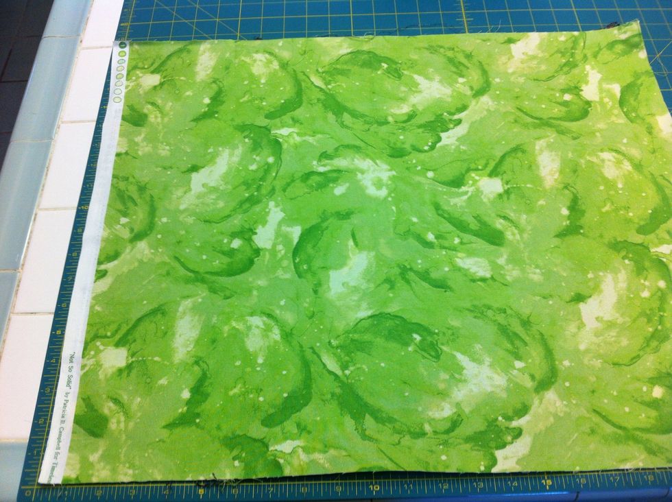 CUT. Align fabric on rotary cutting mat. Trim 2 sides to straighten. You can stack the 2 fat-quarters.