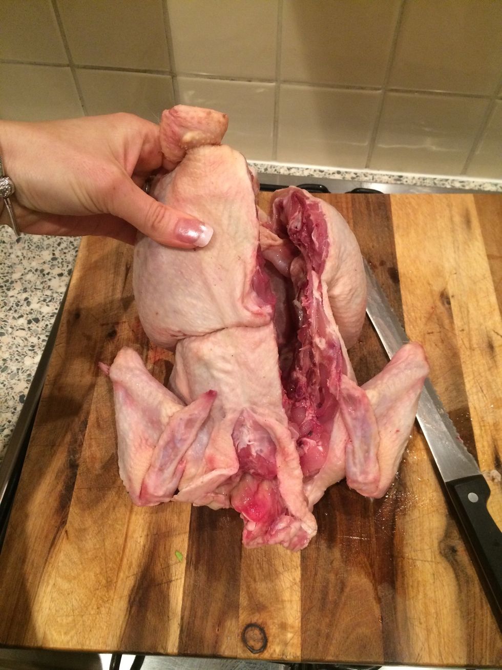 Cut all the way down using and sawing action with the knife and holding the chicken firmly