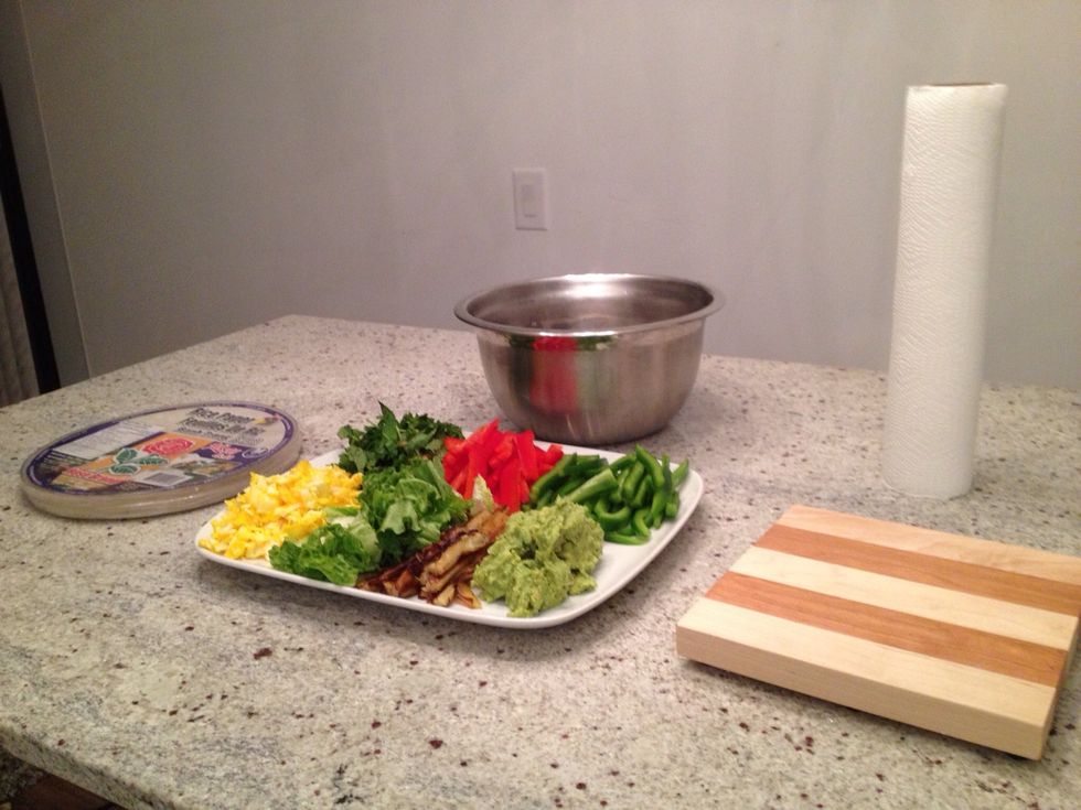 Cut all your favourite vegetables and have them ready. On my plate there are mashed avocado, fried eggplant, lettuce, scramble eggs, peppers and herbs.