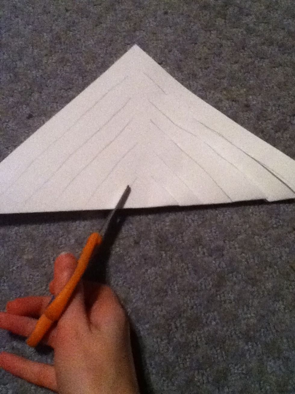 Cut along the diagonal line. Cut threw both layers of the paper