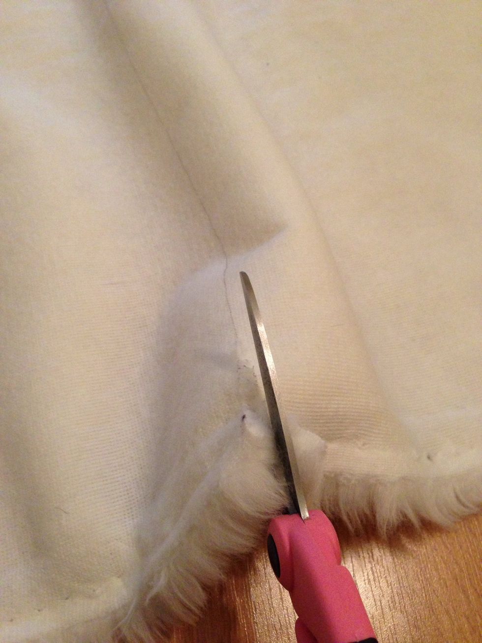 Cut along the line. Tip for cutting fur: cut upside down & use blade to separate fur and cut the lining only.