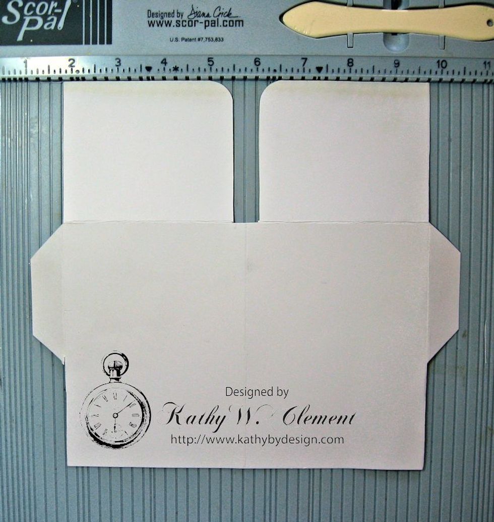 Cut along the lines you just scored, from the top edge to the horizontal scored line. Use a corner rounder to shape the inside corners, if desired.