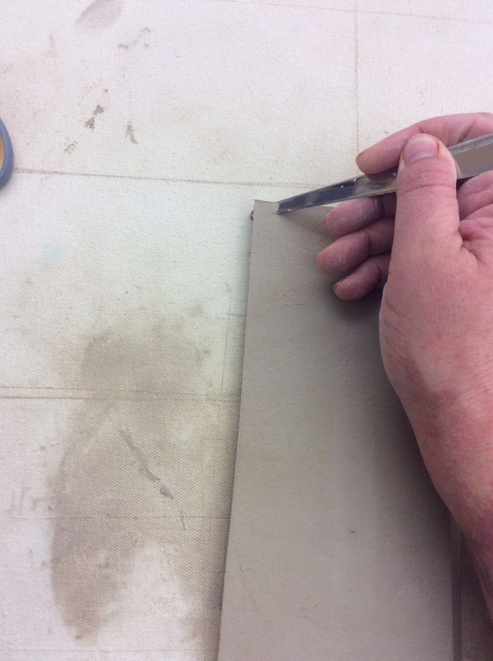 Cut along the long (8") edge at a 45 degree angle.