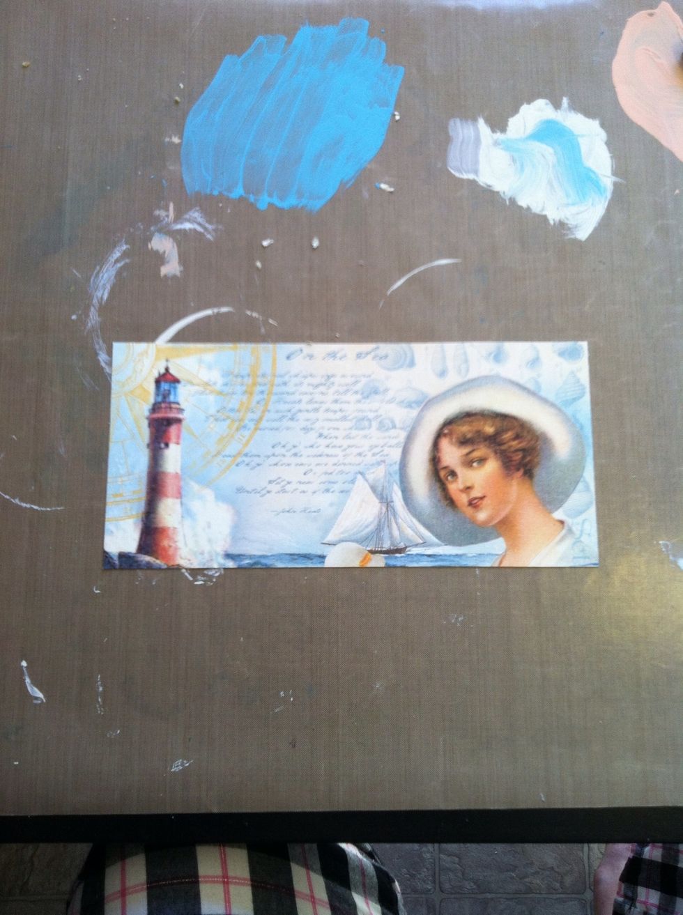 Cut an 8-1/2" by 4" piece of the 'By the Sea' patterned paper. You might need to trim it to fit from top of the can, under the lip, to the bottom.