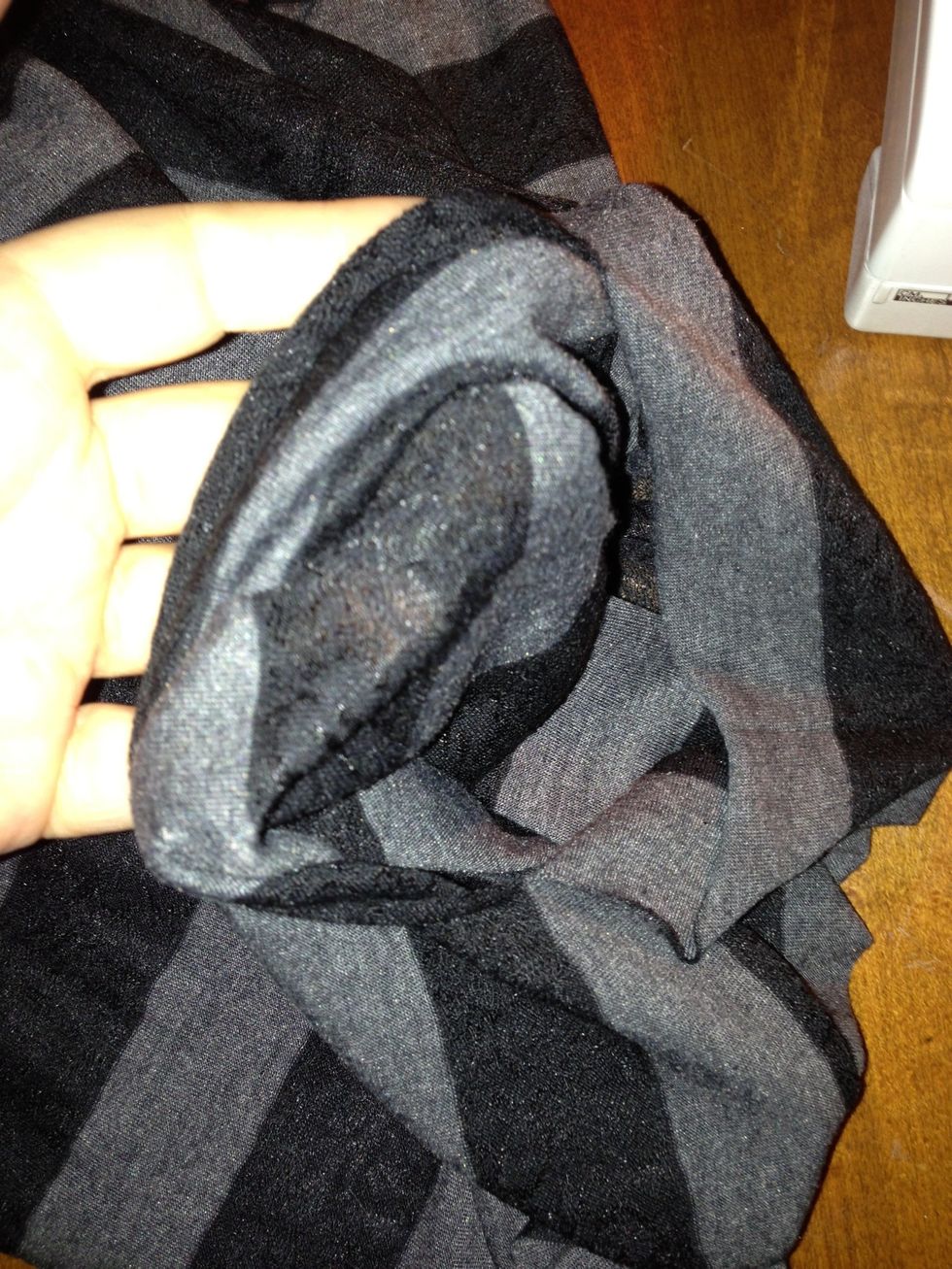 Cut an 8" slit along the center of the fold for the neck hole.